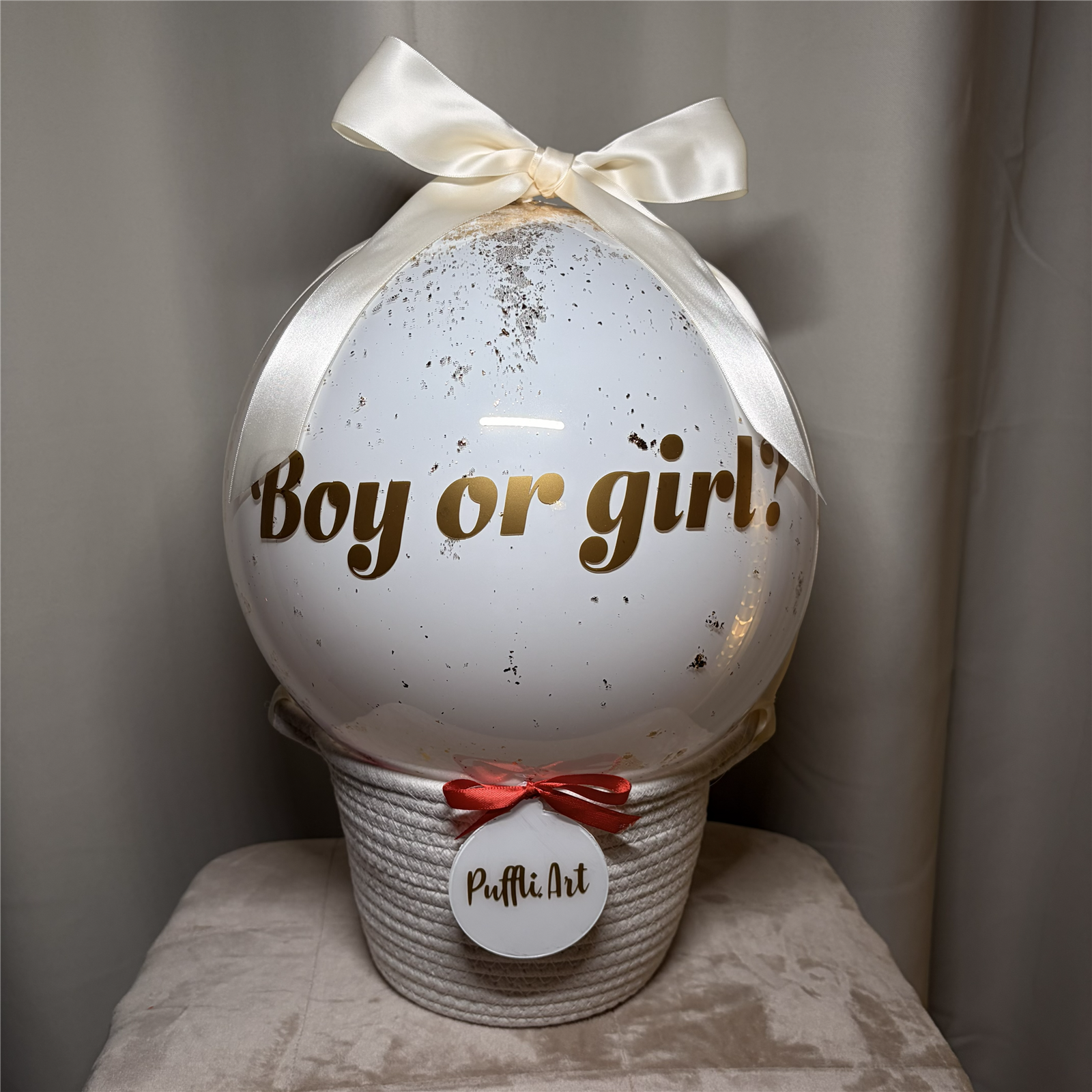 Gender reveal balloon ready to be popped with feathers inside